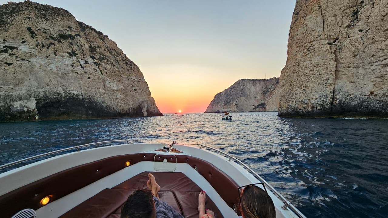 Sunset between the cliffs of Zakynthos, seen from the bow of our boat